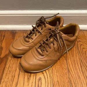 Coach brand, tan sneaker shoes.